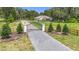Gated entry, mature landscaping and long driveway leading to charming home at 15620 Nw 112Th Ave, Reddick, FL 32686