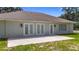 Exterior view of back of house with walk-out patio and three sets of French doors at 15620 Nw 112Th Ave, Reddick, FL 32686