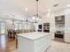 Open concept kitchen with an island and a dining area with an adjacent living room at 15620 Nw 112Th Ave, Reddick, FL 32686