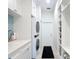 Well-organized laundry room with a sink, counter space, and storage cabinets at 15620 Nw 112Th Ave, Reddick, FL 32686