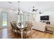 Open concept living and dining room with hardwood floors and lots of natural light at 15620 Nw 112Th Ave, Reddick, FL 32686