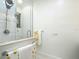 Glass enclosed shower features white subway tile and rainfall shower head at 15620 Nw 112Th Ave, Reddick, FL 32686