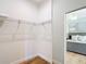 Walk-in closet features hardwood floors, wire shelving and door into bedroom at 15620 Nw 112Th Ave, Reddick, FL 32686