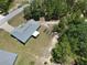 Overhead view of the property showcasing its location in a wooded area with garden beds at 15994 Sw 55Th Avenue Rd, Ocala, FL 34473
