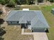 An aerial view of the home, highlighting its architectural style and landscaping at 15994 Sw 55Th Avenue Rd, Ocala, FL 34473
