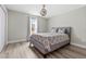 Bedroom featuring a bed with neutral bedding and hardwood floors and natural light at 15994 Sw 55Th Avenue Rd, Ocala, FL 34473
