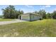 A single story home featuring an attached two car garage at 15994 Sw 55Th Avenue Rd, Ocala, FL 34473