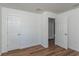 Bedroom with wood-look floors and white doors at 16615 Se 63Rd Ln, Ocklawaha, FL 32179
