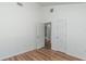 Bedroom with high ceilings, two doors, and view into bathroom with shower at 16615 Se 63Rd Ln, Ocklawaha, FL 32179