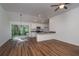 Open concept kitchen with stainless steel appliances and breakfast bar at 16615 Se 63Rd Ln, Ocklawaha, FL 32179