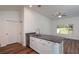 Kitchen with white cabinetry, granite countertops, and stainless steel dishwasher at 16615 Se 63Rd Ln, Ocklawaha, FL 32179