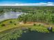 Picturesque lakefront property with lush greenery at 16621 Se 57Th Pl, Ocklawaha, FL 32179