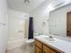 A functional bathroom featuring a combined bathtub and shower, toilet, vanity, and mirror at 16621 Se 57Th Pl, Ocklawaha, FL 32179
