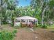 Charming home exterior, showcasing a quaint design and inviting outdoor space at 16621 Se 57Th Pl, Ocklawaha, FL 32179