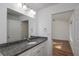 Bathroom with granite countertop vanity and tiled shower at 17009 Se 60Th St, Ocklawaha, FL 32179