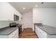 Stylish kitchen featuring granite countertops, stainless steel appliances, and white cabinets with ample storage at 17009 Se 60Th St, Ocklawaha, FL 32179