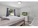 Bright bedroom featuring a large window and neutral decor at 18 Banyan Pass, Ocala, FL 34472