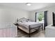 Well-lit bedroom with modern decor and a comfortable bed at 18 Banyan Pass, Ocala, FL 34472