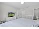 Comfortable bedroom with a ceiling fan and ensuite bathroom at 18 Banyan Pass, Ocala, FL 34472