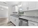 Cozy kitchen featuring stainless steel appliances, granite counters, and modern cabinetry at 18 Banyan Pass, Ocala, FL 34472