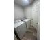 Updated laundry room with side-by-side washer and dryer at 18 Banyan Pass, Ocala, FL 34472