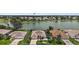 Aerial view of a lakeside home in a golf community at 2002 Enrique Dr, Lady Lake, FL 32159