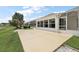 Concrete patio and screened-in enclosure attached to the back of the house at 2002 Enrique Dr, Lady Lake, FL 32159