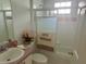 Bathroom with combination shower and tub with glass doors at 2002 Enrique Dr, Lady Lake, FL 32159