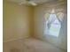 Cozy bedroom featuring neutral walls, carpet flooring and ample natural light at 2002 Enrique Dr, Lady Lake, FL 32159