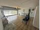 Spacious garage with tiled floors, ample storage and an open overhead door at 2002 Enrique Dr, Lady Lake, FL 32159
