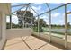 Enclosed patio with view of the lake and gazebo at 2002 Enrique Dr, Lady Lake, FL 32159