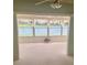 Inviting sunroom featuring large windows with picturesque views of the serene lake at 2002 Enrique Dr, Lady Lake, FL 32159