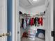 Spacious walk-in closet with ample storage space, shelving and visible hanging racks at 2263 Moines Ct, Dunnellon, FL 34431