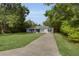 Attractive home with a long driveway and a well-kept lawn at 2263 Moines Ct, Dunnellon, FL 34431