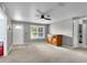 Bright living room with carpet, a white door, and a view of the front yard at 2263 Moines Ct, Dunnellon, FL 34431