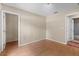 The bedroom has an open closet and a view to the bathroom at 23340 Nw Columbine Ave, Dunnellon, FL 34431