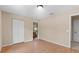 Bright bedroom featuring vinyl wood floors and large closet space at 23340 Nw Columbine Ave, Dunnellon, FL 34431