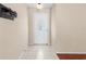 Bright entryway with tiled flooring and decorative front door with glass detailing at 23340 Nw Columbine Ave, Dunnellon, FL 34431