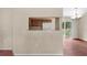Open concept living room and kitchen area, featuring a breakfast bar and sliding glass doors at 23340 Nw Columbine Ave, Dunnellon, FL 34431