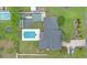 Aerial view of backyard featuring a sparkling pool and meticulously maintained lawn at 2441 Se 38Th St, Ocala, FL 34480