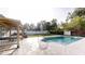 Lovely outdoor space with pool and wooden deck under the pergola, ideal for relaxation at 2441 Se 38Th St, Ocala, FL 34480