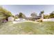 Expansive backyard featuring a refreshing pool, fire pit, shed, and lush green lawn at 2441 Se 38Th St, Ocala, FL 34480