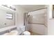 Bathroom showcasing tiled shower, vanity with sink, and coordinated fixtures at 2441 Se 38Th St, Ocala, FL 34480