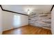 Cozy bedroom with hardwood floors and a unique accent wall at 2441 Se 38Th St, Ocala, FL 34480