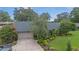 Charming home with a well-maintained lawn, beautiful landscaping, and a cozy bench at 2441 Se 38Th St, Ocala, FL 34480