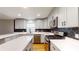 Bright kitchen with stainless steel appliances, quartz countertops, and stylish black and gold backsplash at 2441 Se 38Th St, Ocala, FL 34480
