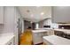 Modern kitchen featuring stainless appliances, island, and views into living area at 2441 Se 38Th St, Ocala, FL 34480