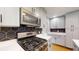 Close up of the gourmet kitchen featuring a stainless steel gas range and microwave at 2441 Se 38Th St, Ocala, FL 34480