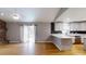 Spacious living room and kitchen area with stainless steel appliances and breakfast bar at 2441 Se 38Th St, Ocala, FL 34480