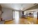 Spacious living room featuring hardwood floors, brick fireplace, and easy access to kitchen at 2441 Se 38Th St, Ocala, FL 34480